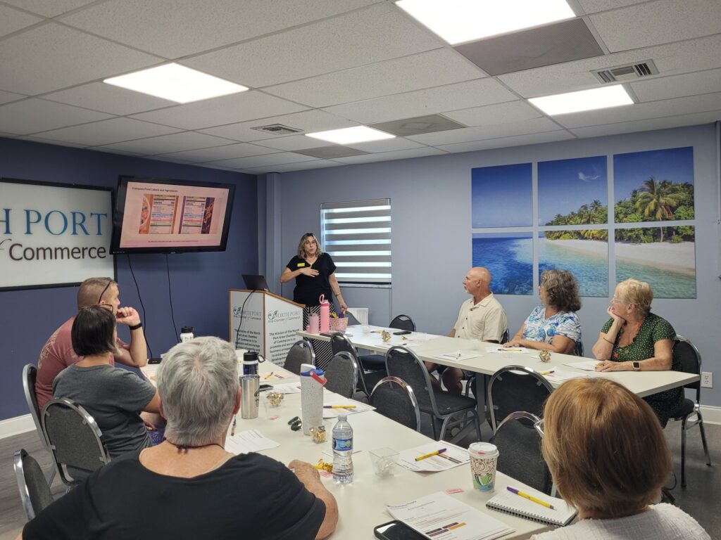 Dianne teaching an in-person AI class to a group of older adults.