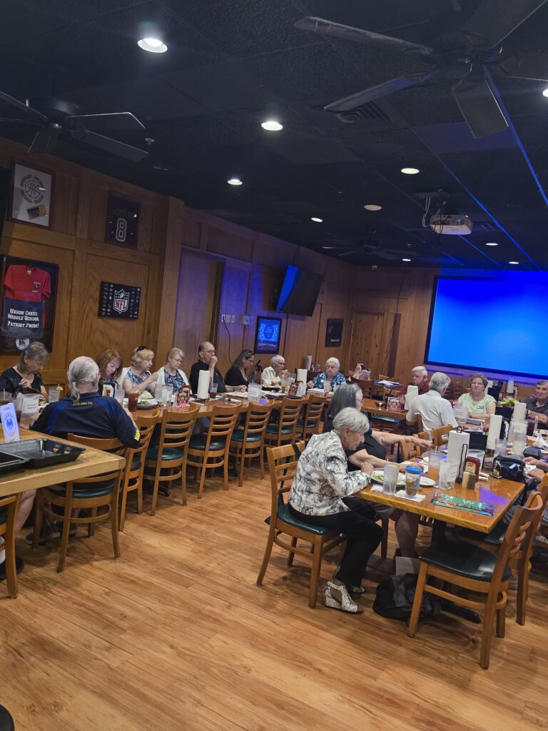 Attendees seated around tables during the North Port Chapter 1713 AI training.